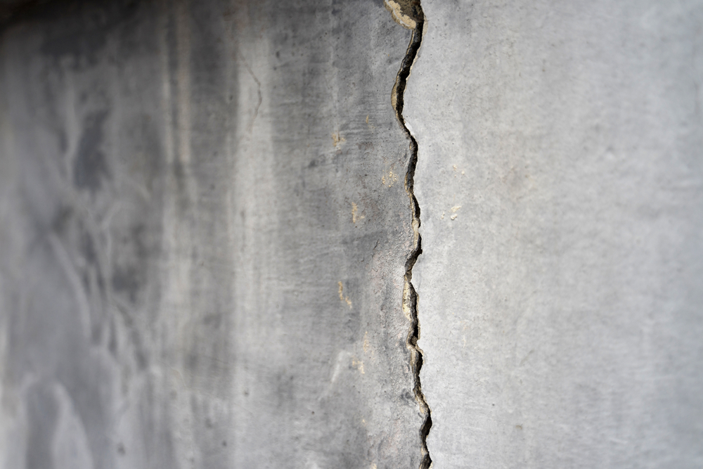 Old,foundation,and,plaster,wall,with,cracks.,building,requiring,repair